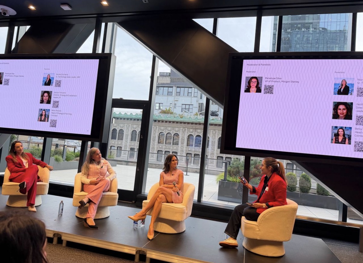 Betsy Rosado, fellow panelists, and moderator in conversation at the IBM office